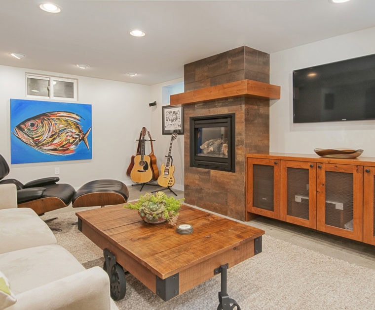 basement room five guitars fish oil painting eames lounge chair ottoman