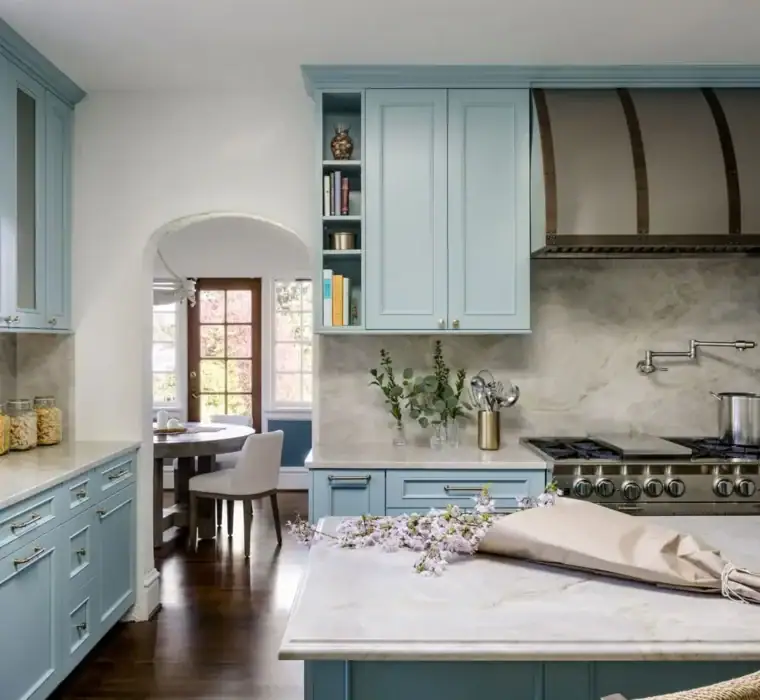 Open concept kitchen remodel with skylight, blue cabinetry, and marble backsplash in Seward Park, Seattle